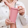 Insulated tumbler with a straw